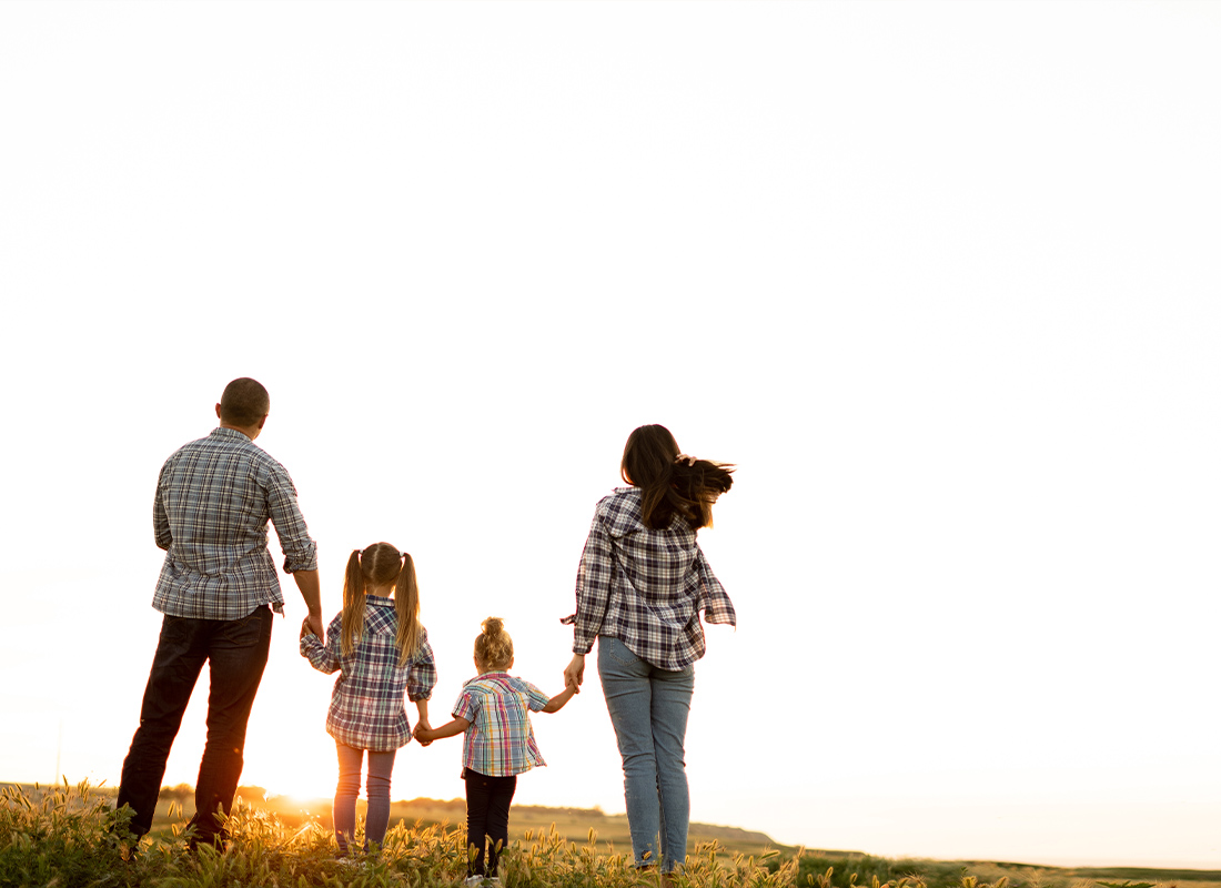 Umbrella Insurance - Parents and Children Looking at the Sunset sky